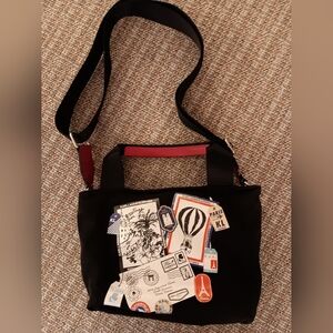 Stylish Black Men's Bag with Graphic Accents